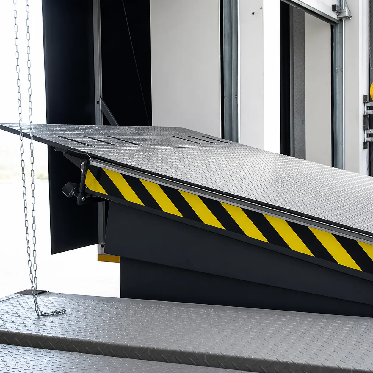 Close-up of a hinged-lip dock leveler platform.