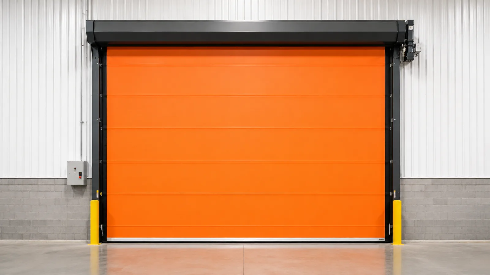 Orange PVC roll-up high speed door in an industrial opening.